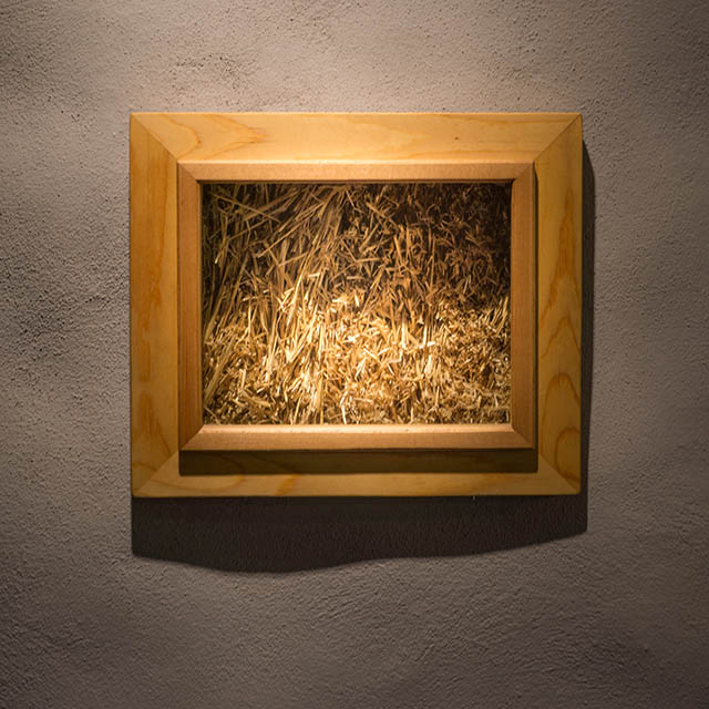 about the inn - straw in wall